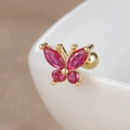 Macro view of gold butterfly ear stud featuring vibrant pink zircon stones for cartilage - 60078 Large - Gold - Red Butterfly