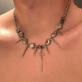 Punk style titanium steel necklace with cross and cone charms on male model neck - Silver-Tone with Purple Cross Spike (X3736)