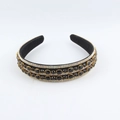 Close-up of double-layered black headband with rhinestones and oval gemstones - Black