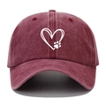 Close-up of heart and paw print embroidery on washed burgundy cotton baseball cap - Burgundy