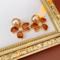 Macro detail of amber floral earrings with golden edges and a pearl accent - Silver Pin-Coffee (Real Gold Plating)