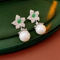 Detailed shot of vintage flower earrings with green gems and white pearls on velvet - Green Zircon Single Large Pearl Style (WE2015) / Silver/Green