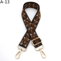 Detail of adjustable guitar-style strap featuring ethnic jacquard weave and gold hardware - A-13 Black Brown White