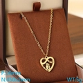 Golden stainless steel heart pendant necklace with infinity symbol on a jewelry box - Infinity Symbol Couple Silhouette Heart (KN292741-Z)