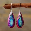 Macro detail of bohemian teardrop earrings with colorful stone texture on a wooden branch - Purple Stone Silver Color Hook