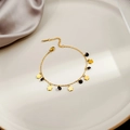 Minimalist gold heart and black bead bracelet with lobster clasp on a luxury tray - Black Gold Flower(S226)