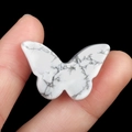 Polished white marble butterfly crystal stone ornament with natural grey veining - Howlite