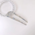 U-shaped hair fork in blue and grey marble acetate finish on glass tray - Floral Blue Gray Marble