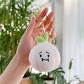 Funny garlic plush keychain with green leaves and grumpy face on soft white texture - Garlic Clove with Closed Mouth Gold Clasp