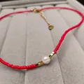 Red beaded necklace featuring a white freshwater pearl and gold metallic square accents - Red Freshwater Pearl Necklace (38+5CM)