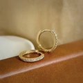 Elegant gold plated S925 silver huggie earrings with sparkling CZ stones set on a leather base - 14K Gold / Gold