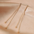 Golden long tassel earrings with double chains and metal beads on champagne silk - Gold Ball Tassel