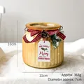Photophore de Noël en verre doré côtelé avec pomme de pin et nœud à carreaux rouges - Or Large avec Étiquette Lettre (10x11cm/368g)