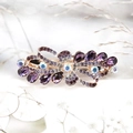Pince à cheveux élégante en or rose avec strass violets et motif nœud en cristal - Fleurs abondantes / Violet