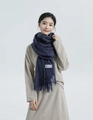 Thick navy blue wool blend winter scarf with fringe details worn by a female model - Wool Style / 200x70cm / Heather Navy