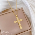 Detailed view of a gold cross necklace with sparkling diamonds and heart center design - Golden Cross Heart Style (A529)