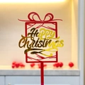 Macro shot of red and gold acrylic Happy Christmas cake topper with festive background - Red Gold Gift Box 2 Happy Christmas