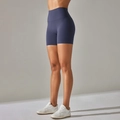 Side view of high-waist navy yoga shorts showing body-shaping fit and matte fabric - Dark Blue