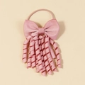 Dettaglio di un fiocco per capelli rosa in canneté con nappe a spirale ed elastico morbido - Rosa