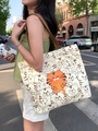 Off-white canvas tote bag with orange tiger cartoon prints and dark brown woven straps - Lucky Tiger Cartoon Print - Beige