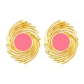 Detail of vintage geometric 18K gold plated earrings with pink enamel swirl patterns - Pink