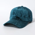 Detailed view of the soft velvet texture and curved brim on this teal baseball cap - One Size / Lake Green