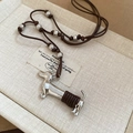 Silver dachshund pendant necklace with dark brown adjustable cord on beige gift box - Brown