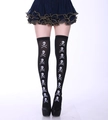 Over-the-knee socks in black with white skull and crossbones print for Halloween - One Size / Vertical Skull