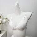 Elegant white lace bralette with triangle cups and thin straps on a mannequin - White
