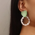 Chic earring with green resin heart and white baroque pearl hoop on model - Green KC Gold (Green Heart Pearl)