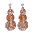 Macro detail of Bohemian wire-wrapped heart earrings with amber gemstone inlays - Triple Layer