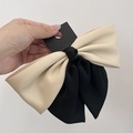 Detail of two-tone cream and black bow hair clip with high-quality matte fabric - Black+Beige