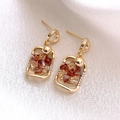 Close-up of geometric square drop earrings with amber crystal in gold-tone metal frame - Geometric Square Earrings (925 Silver Needle) / Gold
