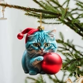 Cute acrylic blue cat ornament with red Christmas hat and ball on a festive tree branch - Cat 5
