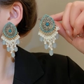 Close-up of vintage ethnic earrings with turquoise rhinestones and white pearl tassels - 60# Silver Pin-Gold-Blue