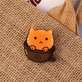 Cute orange cartoon cat enamel pin on textured fabric background for bags and clothing - Coffee Cat
