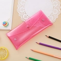 Macro detail of pink glitter PVC stationery pouch with a functional snap button closure - Glitter Pink