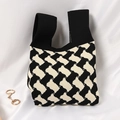Knitted tote bag featuring black and white geometric diagonal patterns and wide handle - Black Rice Biscuits