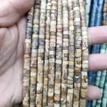 Macro shot of natural Jasper stone spacer beads in earthy tones for DIY jewelry making - Jasper