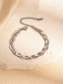 Detail of silver woven snake chain bracelet with adjustable lobster clasp on stone - Silver Bracelet