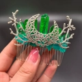Detailed shot of green crystal hair comb with silver metal branch and hollow patterns - Green Blue + Branch + Moon