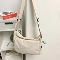 Minimalist beige nylon messenger bag with waterproof fabric and adjustable wide shoulder strap - White