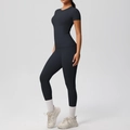Side view of black slim fit yoga set featuring a short sleeve tee and high waist leggings - S / Black