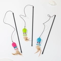 Three cat teaser wands with colorful plush fish and feathers on black rods - Sequin Fish Feather