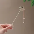 Golden Chinese hair pin with green bamboo leaf inlay and elegant pearl tassels - Bamboo Leaf