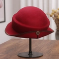 Detail of burgundy wool felt cloche hat featuring brown stitching and a decorative button - M(56-58cm) / Burgundy
