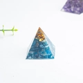Blue natural crystal stone energy pyramid in clear resin for office desk decor - Apatite
