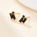 Detailed view of S925 sterling silver studs with black zircon and rectangular gems - Gold Black Zirconia