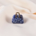 Blue natural stone mini handbag pendant with a golden handle and unique white textures - Sodalite