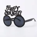 Black Happy New Year themed party glasses with round lenses and decorative lettering - Black New Year Glasses With Small Holes